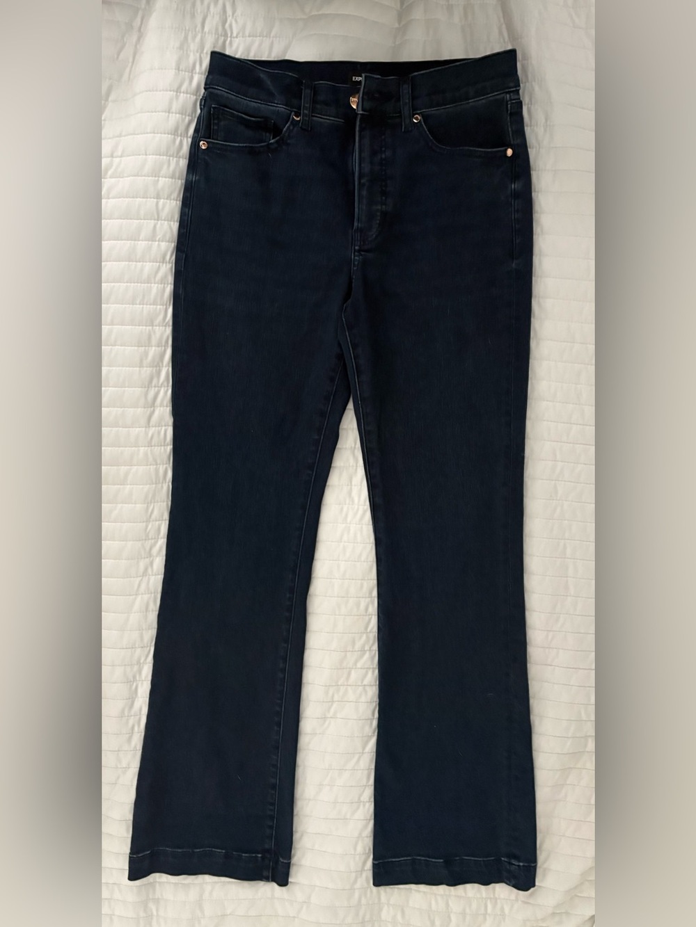 Express women’s Dark blue mid rise boot cut jeans size 8.